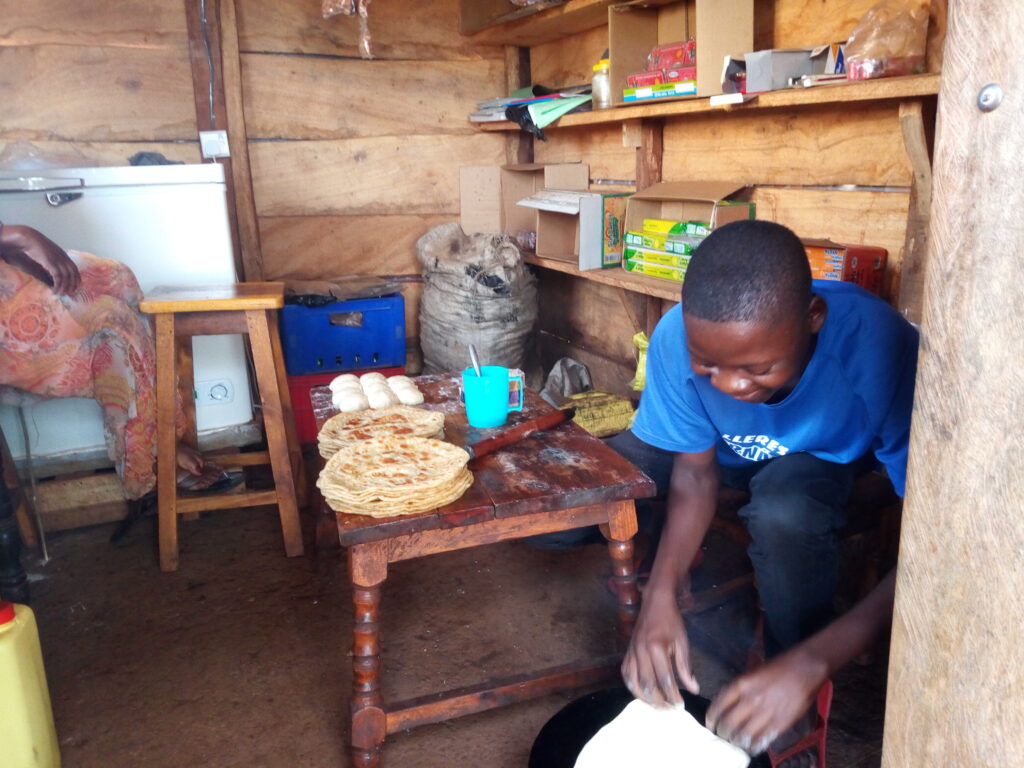 young boy working in Uganda with SALVE