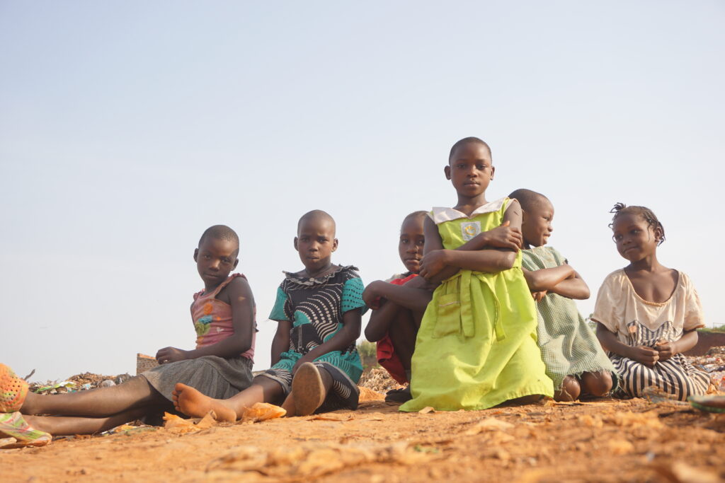 A group of children sat on the floor