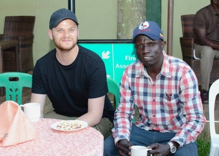 Lucas Mee and Alfred Ochaya , seated at a table